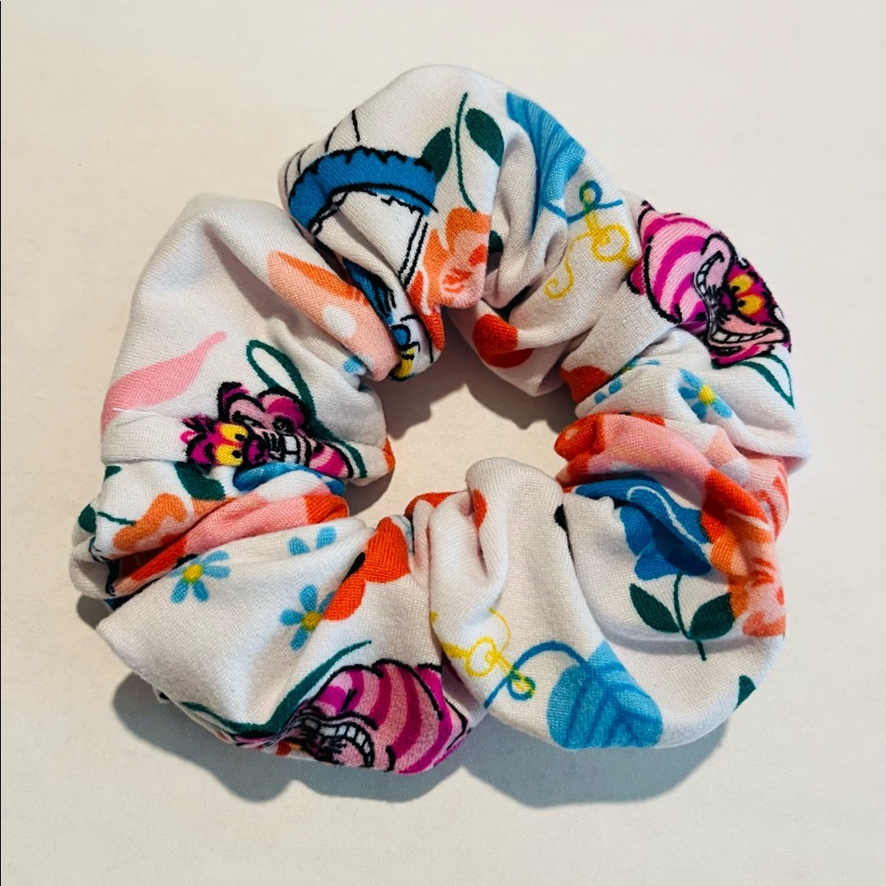 Disney Alice in Wonderland Scrunchie, measures 7 inches around.